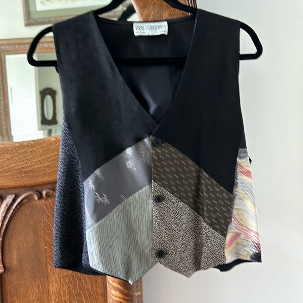Vintage designer vest. Multiple patterns. Bust 16”. Length 19”